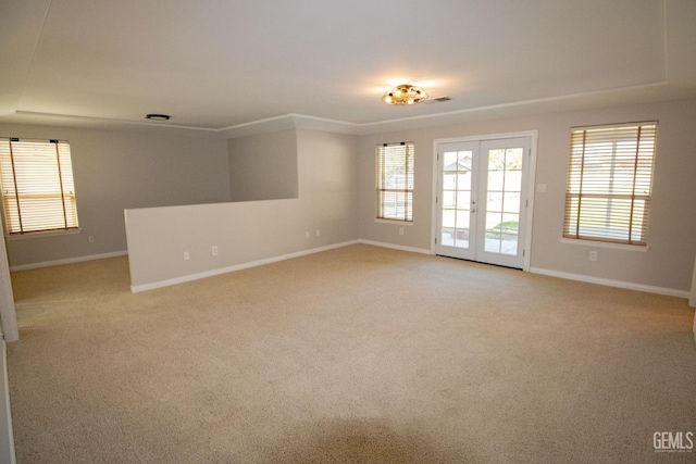 carpeted empty room with french doors