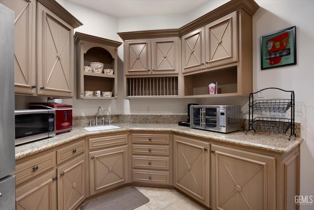 214 Driver Rd, Bakersfield, CA 93314 - kitchen featuring a sink, open shelves, stainless steel microwave, and light countertops