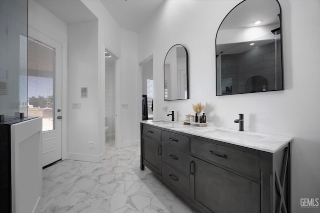 214 Driver Rd, Bakersfield, CA 93314 - bathroom with marble finish flooring, double vanity, toilet, baseboards, and recessed lighting