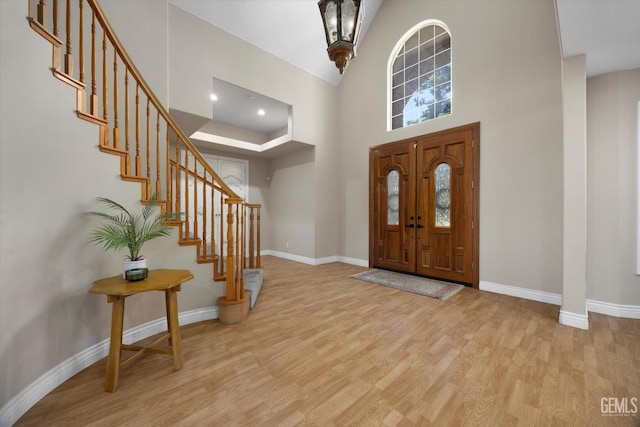 214 Driver Rd, Bakersfield, CA 93314 - entryway with wood finished floors, baseboards, stairs, and a high ceiling