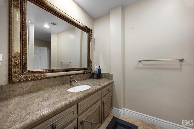 214 Driver Rd, Bakersfield, CA 93314 - bathroom with vanity, baseboards, and tile patterned floors