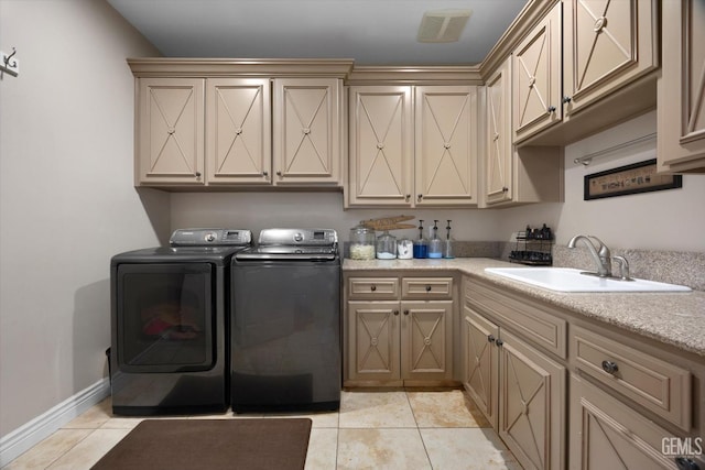 214 Driver Rd, Bakersfield, CA 93314 - washroom with washer and dryer, cabinet space, and light tile patterned floors