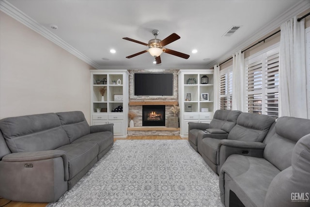 214 Driver Rd, Bakersfield, CA 93314 - living room with crown molding, a ceiling fan, light wood-type flooring, a fireplace, and recessed lighting