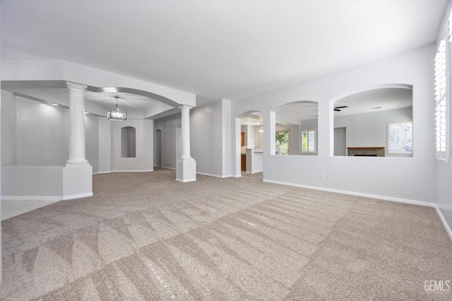 interior space featuring baseboards and carpet