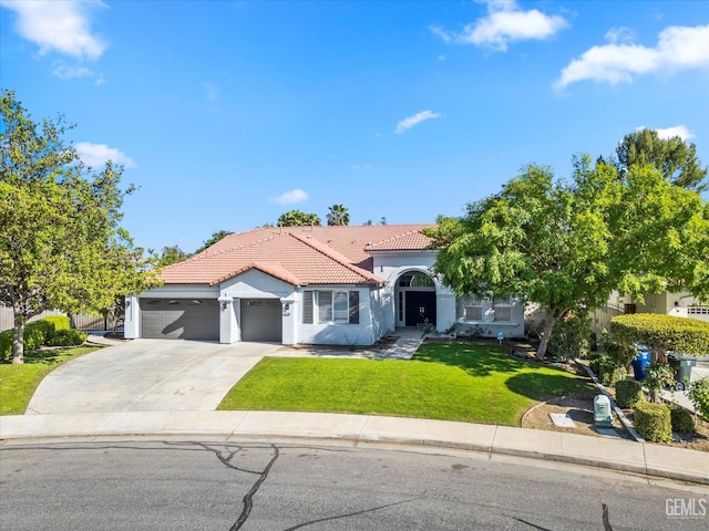 view of front of house with a front yard, an attached garage, a tile roof, stucco siding, and driveway