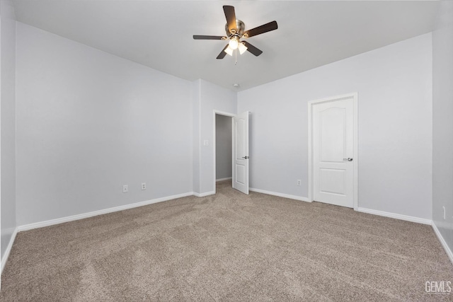 unfurnished bedroom featuring carpet flooring, baseboards, and a ceiling fan