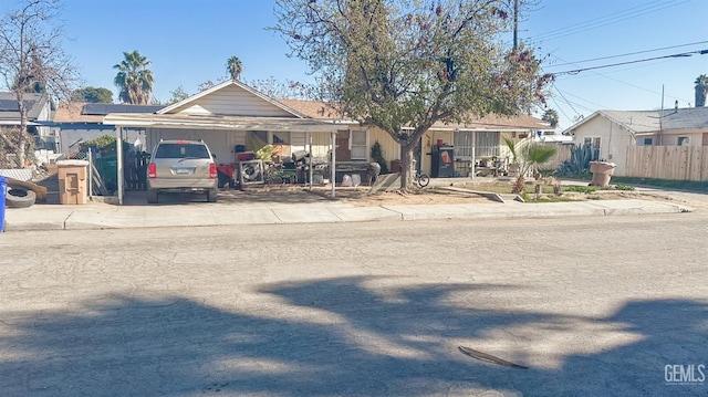 view of front of property featuring a carport