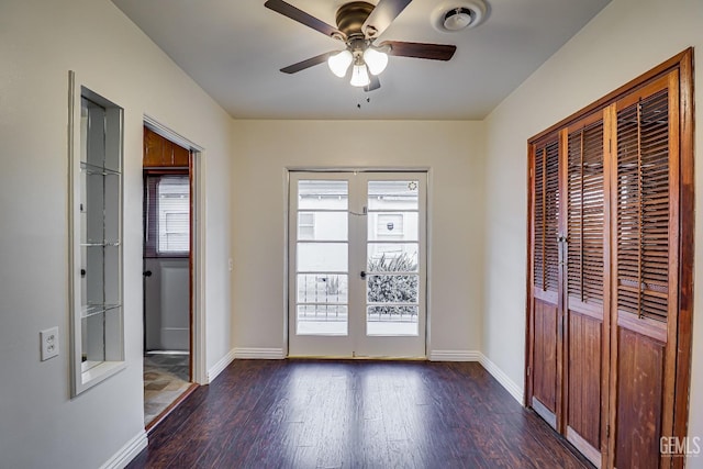 doorway to outside with dark hardwood / wood-style floors, french doors, and ceiling fan