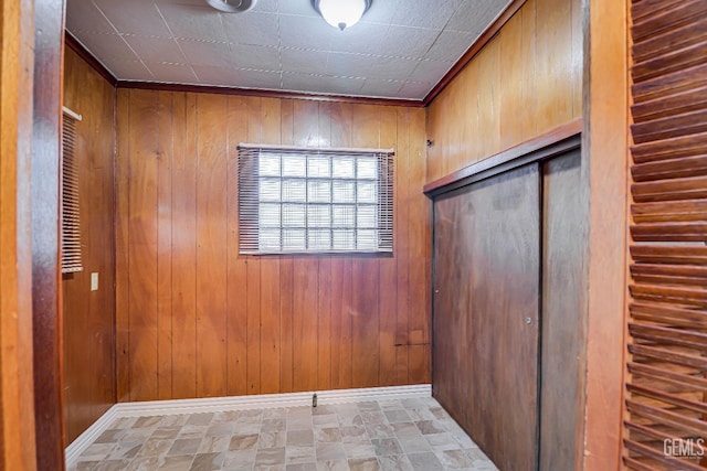 interior space featuring wood walls