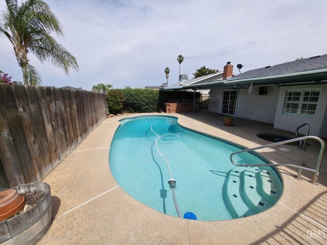 1301 5th Pl, Delano, CA 93215 - view of swimming pool with a patio