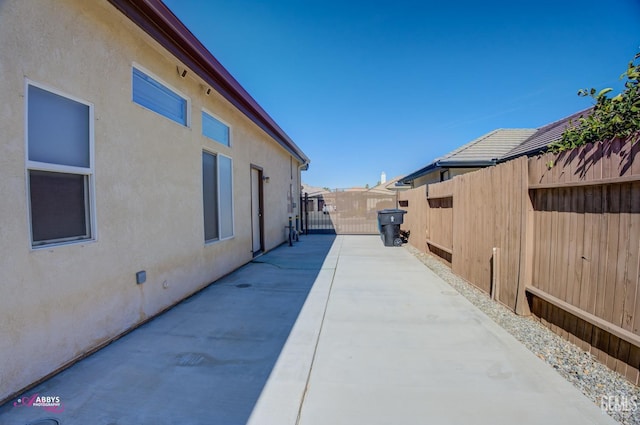 view of property exterior with a patio