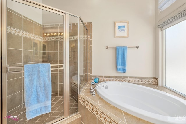 bathroom with separate shower and tub