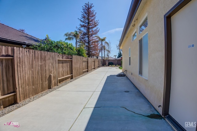 view of side of home with a patio area