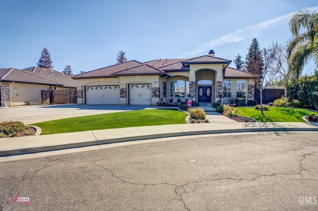 view of front facade featuring a garage and a front yard