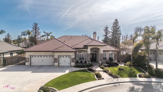 view of front of house with a garage and a front lawn