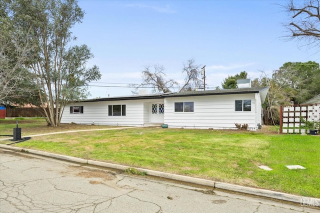 view of front of property with a front lawn