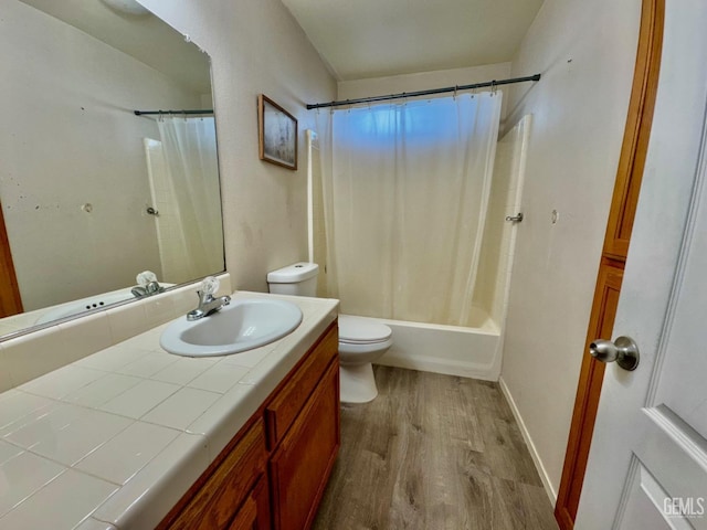 bathroom with shower / bath combination with curtain, vanity, toilet, and wood finished floors