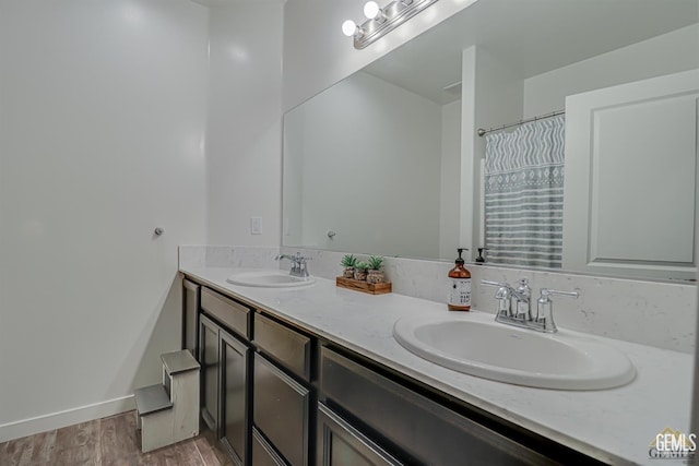 bathroom featuring hardwood / wood-style floors and vanity