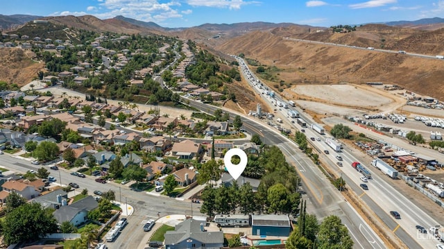 birds eye view of property with a residential view and a mountain view