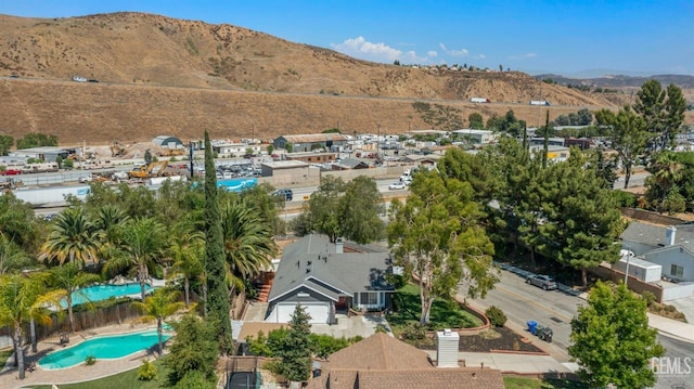 birds eye view of property with a residential view and a mountain view