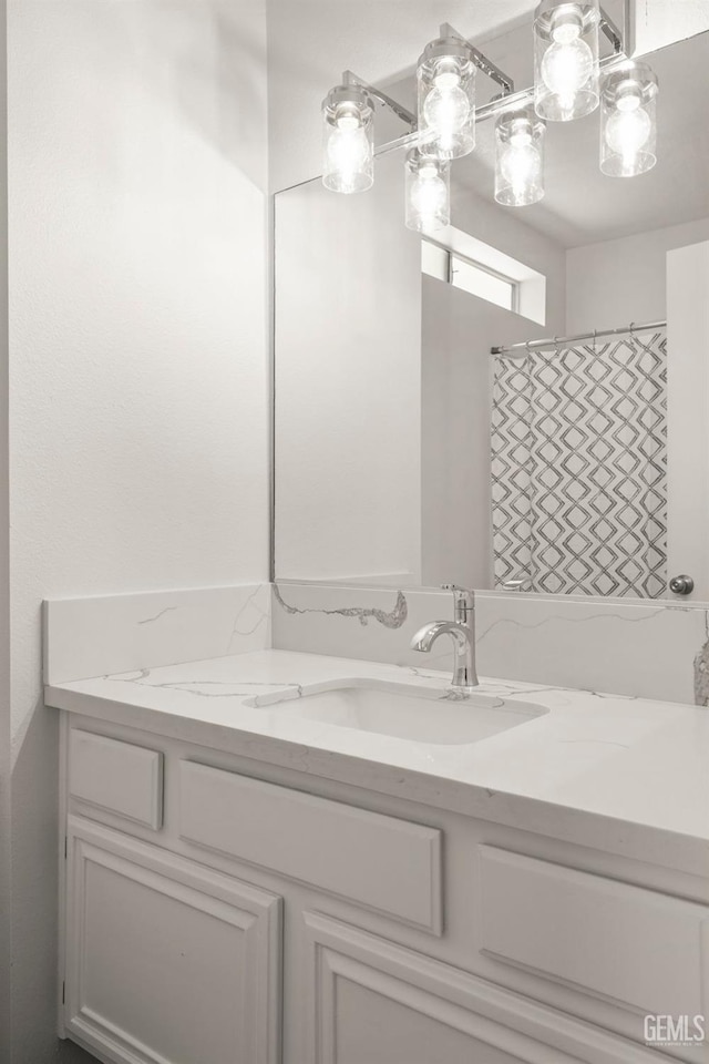 full bathroom featuring vanity