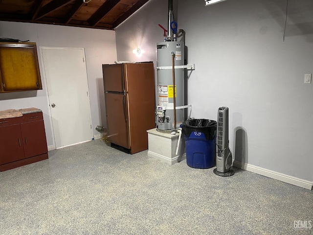 basement featuring water heater and refrigerator