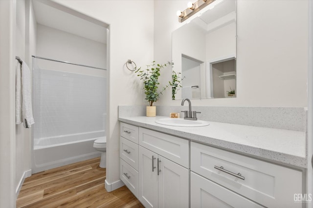 30717 Paseo De Pico, Shafter, CA 93263 - full bath with vanity, wood finished floors, and shower / washtub combination