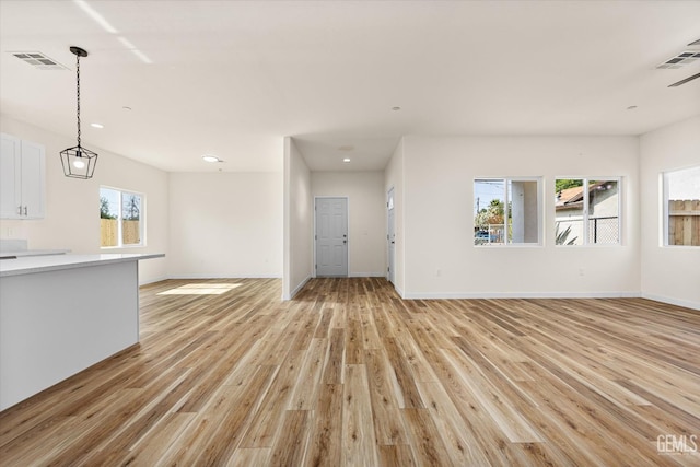 30717 Paseo De Pico, Shafter, CA 93263 - unfurnished living room with light wood-style floors and recessed lighting