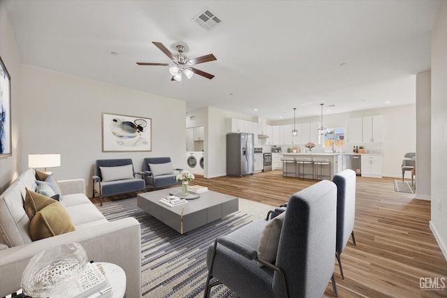 30717 Paseo De Pico, Shafter, CA 93263 - living area with washer / clothes dryer, ceiling fan, light wood-type flooring, and recessed lighting