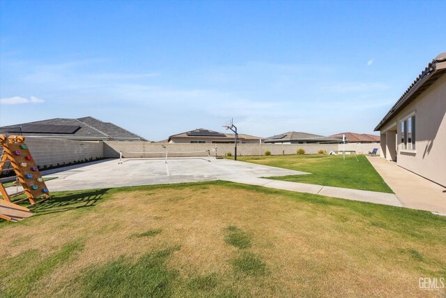 view of yard with a patio area and a fenced backyard