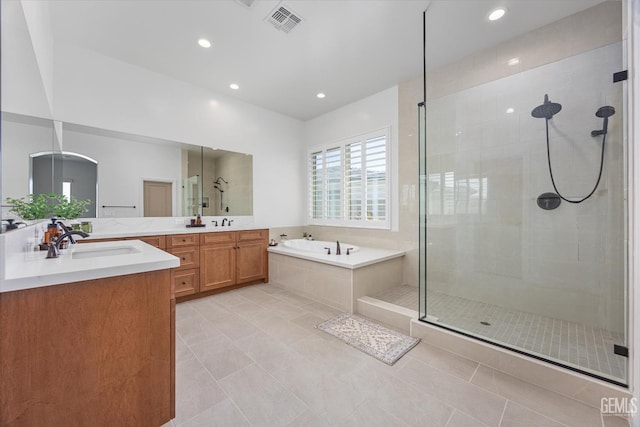 bathroom featuring a shower stall, a garden tub, vanity, tile patterned flooring, and visible vents