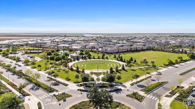 drone / aerial view featuring a residential view and a water view