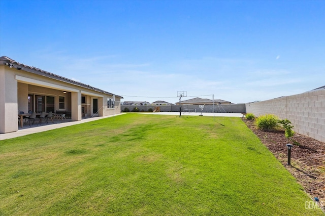 view of yard featuring a patio area and a fenced backyard
