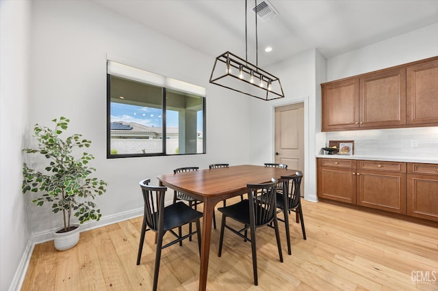 dining area with recessed lighting, light wood-type flooring, visible vents, and baseboards