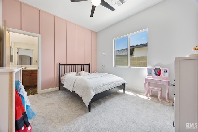 carpeted bedroom with baseboards, a ceiling fan, and visible vents
