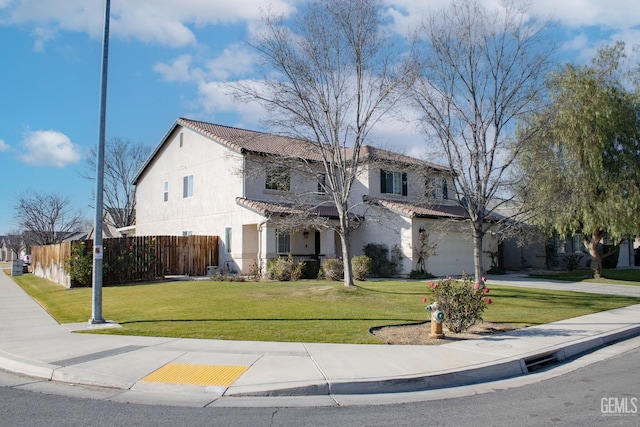 view of front facade featuring a garage and a front lawn