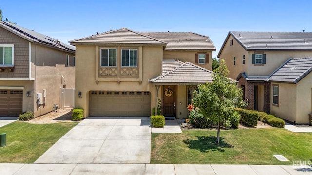 view of front of property featuring a garage and a front yard