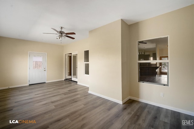 917 Newcastle Ct, Shafter, CA 93263 - spare room featuring wood finished floors, a ceiling fan, and baseboards