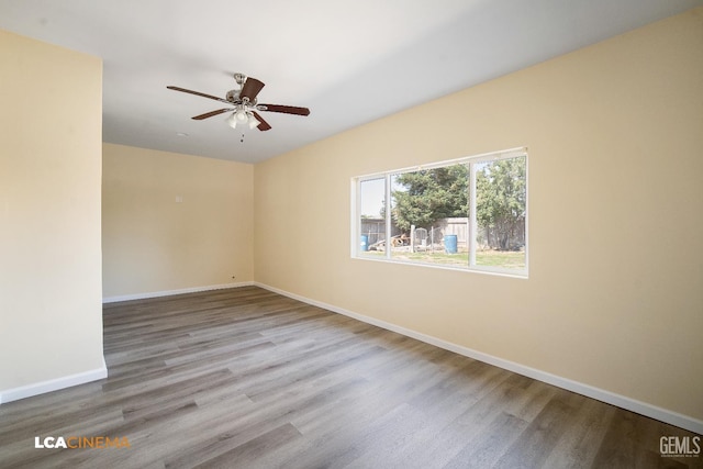 917 Newcastle Ct, Shafter, CA 93263 - spare room with wood finished floors, baseboards, and a ceiling fan