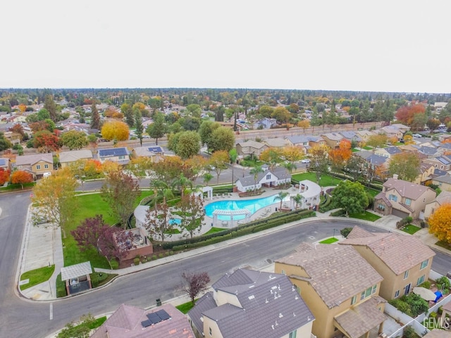 birds eye view of property with a residential view