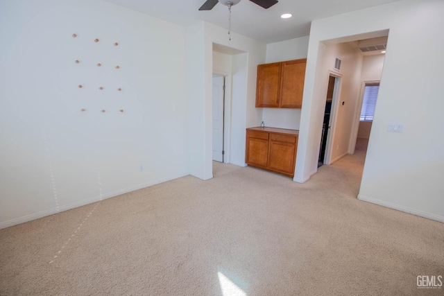 unfurnished living room featuring recessed lighting, visible vents, light carpet, ceiling fan, and baseboards