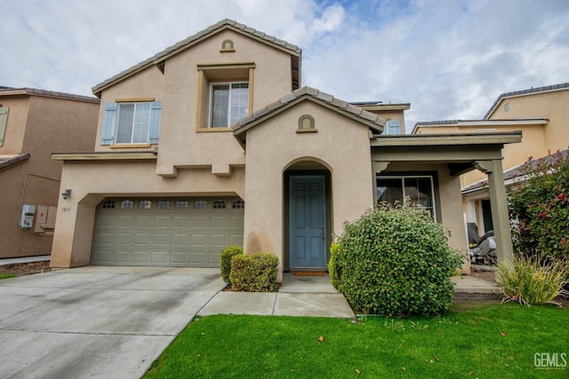 mediterranean / spanish house featuring a garage, concrete driveway, a tiled roof, and stucco siding