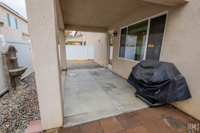 view of patio featuring a fenced backyard and area for grilling