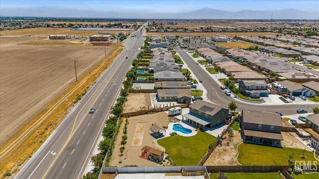 10026 Murfreesboro Dr, Bakersfield, CA 93311 - aerial view of residential area with a pool and a mountainous background