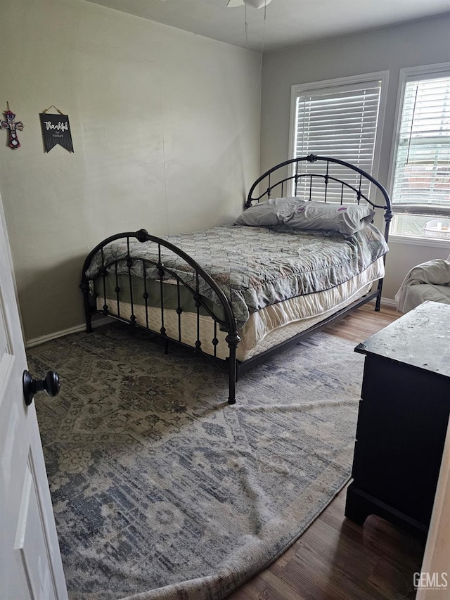 bedroom featuring dark wood-type flooring