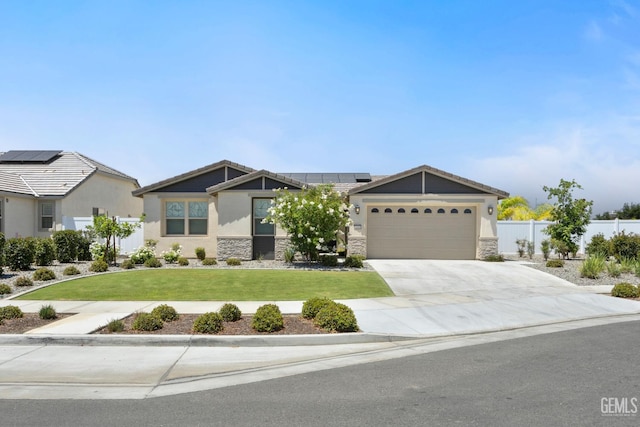 14610 Coyle Cir, Bakersfield, CA 93311 - view of front of home featuring an attached garage, concrete driveway, solar panels, and stone siding