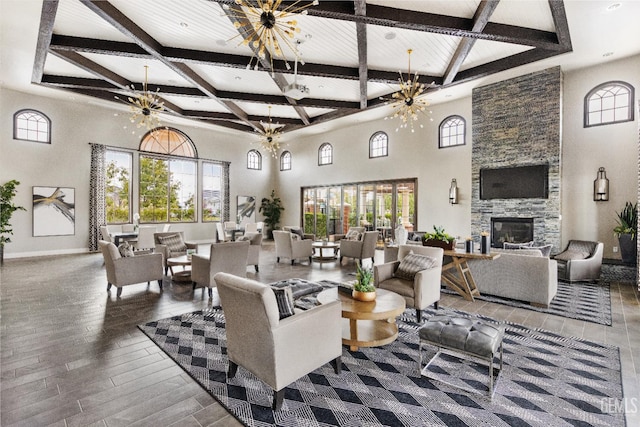 14610 Coyle Cir, Bakersfield, CA 93311 - living room featuring beamed ceiling, a high ceiling, coffered ceiling, wood finished floors, and a fireplace