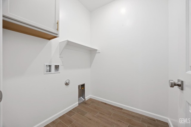 14610 Coyle Cir, Bakersfield, CA 93311 - washroom with cabinet space, wood finished floors, and washer hookup