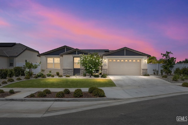 14610 Coyle Cir, Bakersfield, CA 93311 - ranch-style house featuring concrete driveway, stone siding, a garage, roof mounted solar panels, and stucco siding