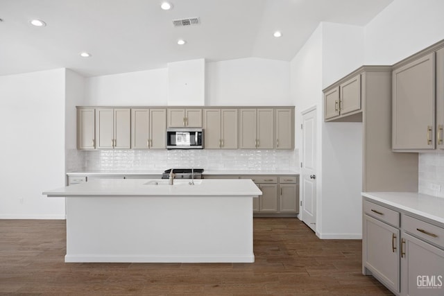 14610 Coyle Cir, Bakersfield, CA 93311 - kitchen featuring stainless steel microwave, gray cabinets, backsplash, and recessed lighting